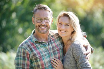Man and woman smiling after gum treatment, nashville tn