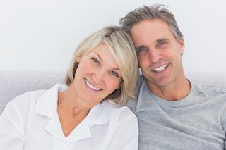 smiling couple after oral surgery in brentwood tn