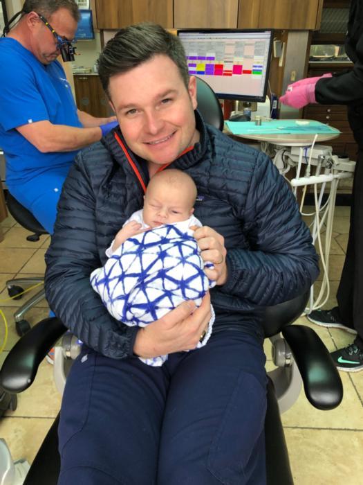 Richard Sullivan, IV holding baby