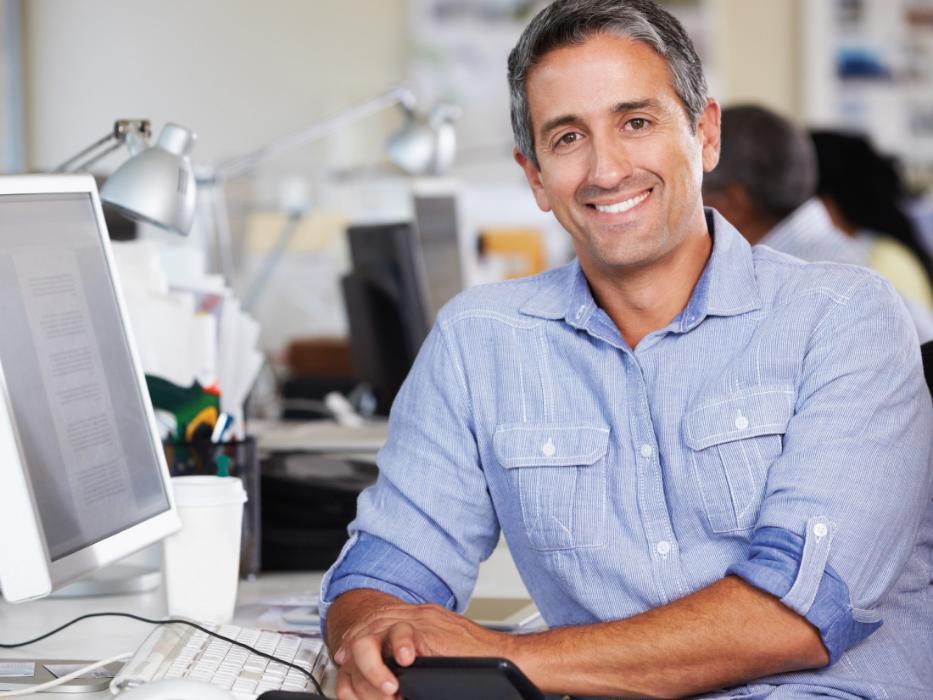 man smiling with dental crowns in brentwood tn