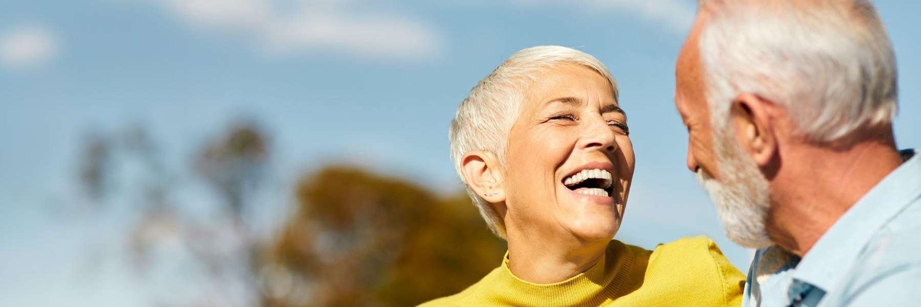 Older woman smiling at man after dental implant, nashville tn