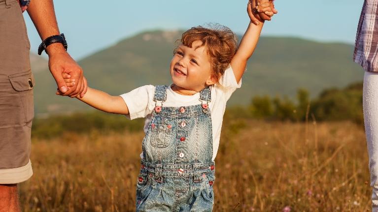 baby holding hands with parents | pediatric dentistry brentwood TN