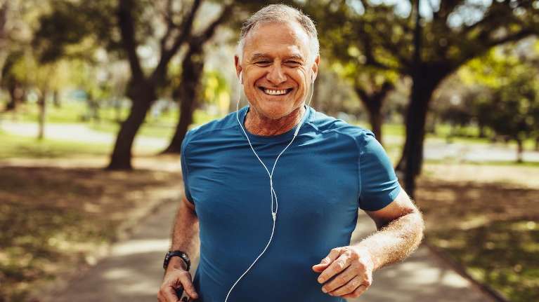 A man jogging in the park | dentist near Nashville