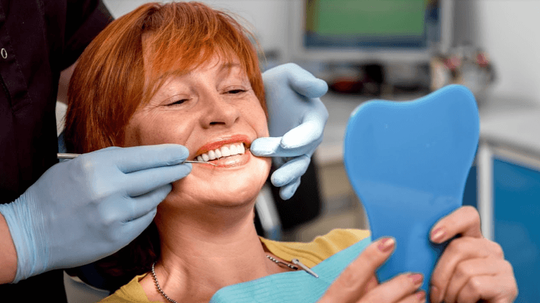 Older woman getting digital dentures in brentwood tn