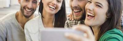 Friends smiling after cosmetic dentistry treatment, brentwood tn