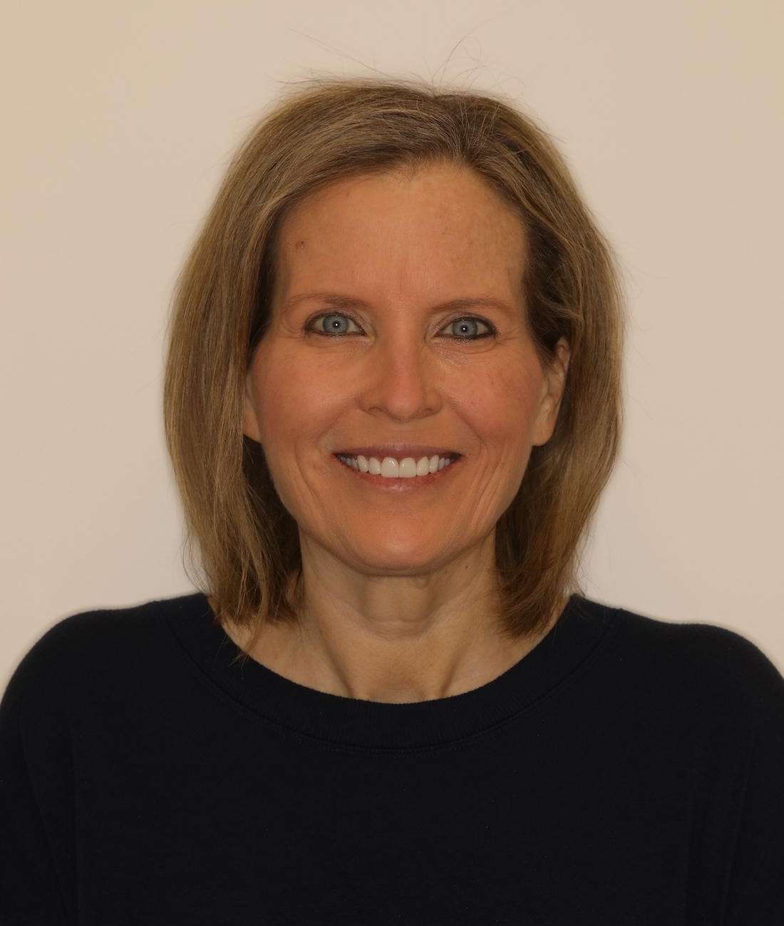 Woman smiling after cosmetic crowns, brentwood tn