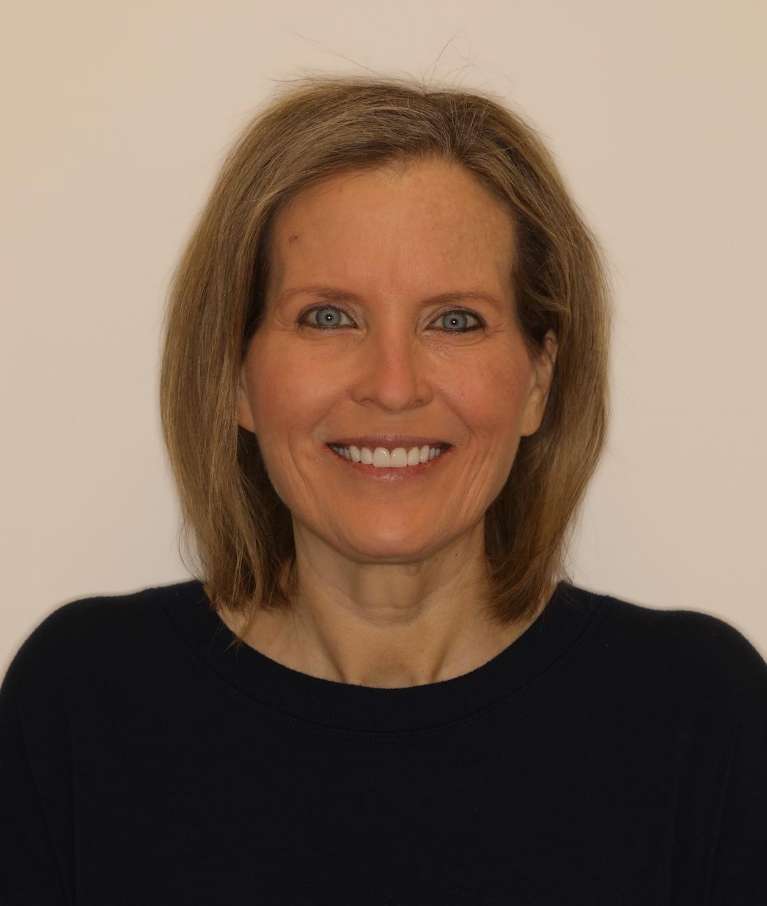 Woman smiling after cosmetic crowns, brentwood tn