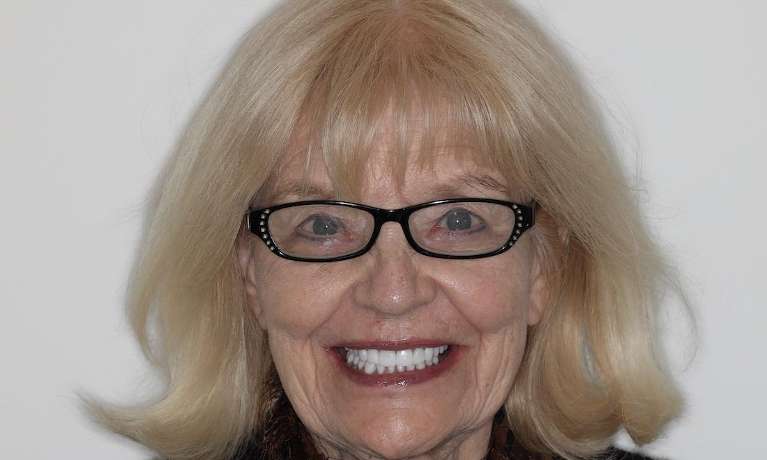 Full head view of elderly woman smiling after cosmetic crowns, brentwood tn